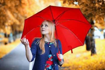 Girl in the street with an umbrella