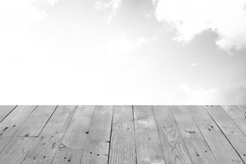 The blur cool blue sky white cloud with old Wooden table