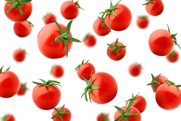 Falling tomato cherry isolated on white background, selective focus