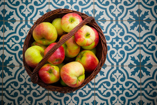 Basket Of Apple On Kitchen Tile Floor, Vignette Frame