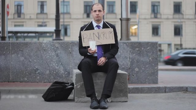 businessman sits asking help  money