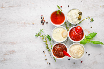 A set of barbecue sauces. Top view. Free space for your text.