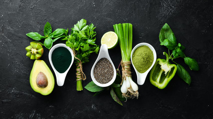 Healthy Green food Clean eating selection Protein source for vegetarians: avocado, lime, onion, apple, kiwi, spirulina. Top view. Free space for your text.