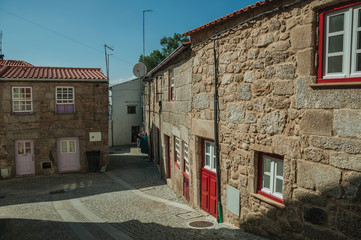 Old house facade made of stone on deserted alley