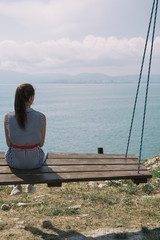 Beautiful girl resting on the sea. 