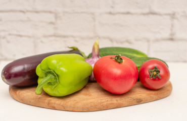 fresh vegetables (tomatoes, cucumbers, garlic, pepper, eggplant) for cooking