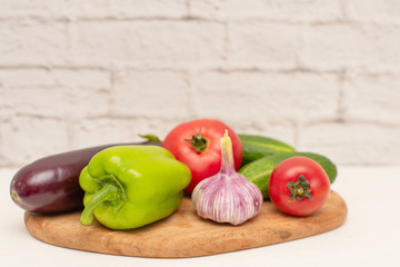 fresh vegetables (tomatoes, cucumbers, garlic, pepper, eggplant) for cooking