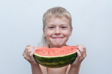 candid portrait of a boy with a watermelon