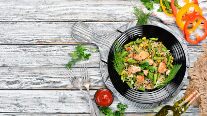 Risotto with chicken fillet and vegetables. Rice. Top view. Free copy space.