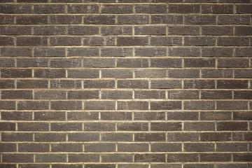 Texture of a dark brick wall