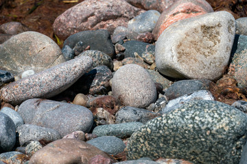 Multi coloured pebbles on a beach