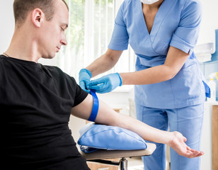 Nurse taking blood sample. Medical equipment.