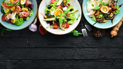 A set of salads. In the plate. Rustic style. Top view. Free space for your text.