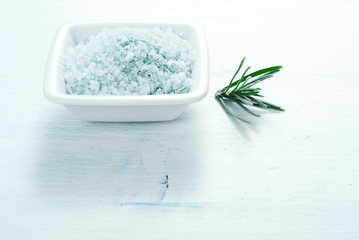 blue bath salt on old white wood table