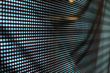 Iluminated black dotted window with an interesting pattern.