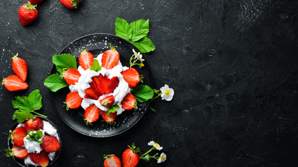 Strawberry with cream in a plate. Dessert. Berries Top view. Free space for your text.