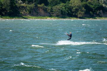 Kite surfers race across the sea