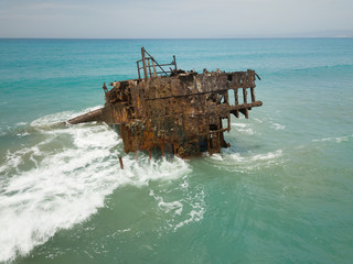 Old rusty ship wreck in the middle of the sea, next to Limmasol, Ciprus