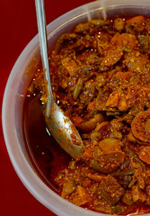 Closeup view of Indian Mixed vegetable pickle, display for sale by street vendor                               