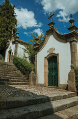 Fototapeta premium Small chapel in baroque style next to stone staircase