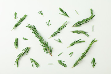 Flat lay composition with rosemary on white background, space for text