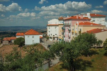 Obraz premium Colorful apartment buildings on hilltop