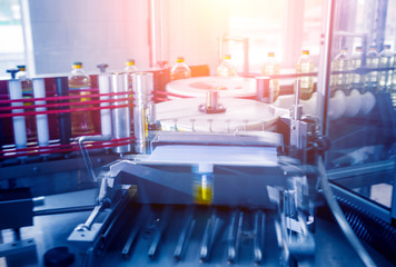 Automatic labeling machine during operation. Factory for the production of vegetable oil.