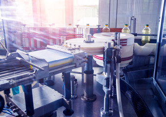 Automatic labeling machine during operation. Factory for the production of vegetable oil.