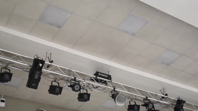 Theatrical lighting mounted on the wall creates a muffled light.Stage lighting is fixed on the ceiling to illuminate objects, light rays and colored light 