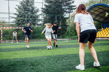 Young Soccer Players Running After the Ball..Running soccer football players.