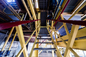 Fototapeta premium Interior of modern natural oil factory. The piping, pumps and motors