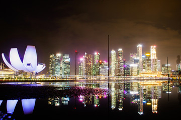 SINGAPORE, SINGAPORE - MARCH 2019: skyline of Singapore Marina Bay at night downtown core...
