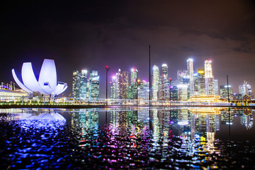 SINGAPORE, SINGAPORE - MARCH 2019: skyline of Singapore Marina Bay at night downtown core...