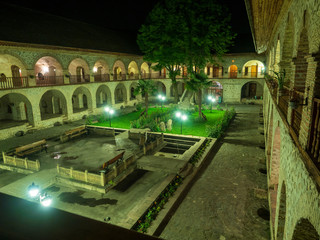 SHEKI, AZERBAIJAN - May 08, 2019 : Courtyard of Caravanserai(or caravansary) building in Sheki,...