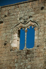 Window in gothic style on a stone wall