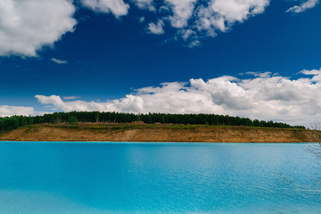 Beautiful turquoise lake in Novosibirsk. Dangerous lake with waste from  the Novosibirsk thermal power station