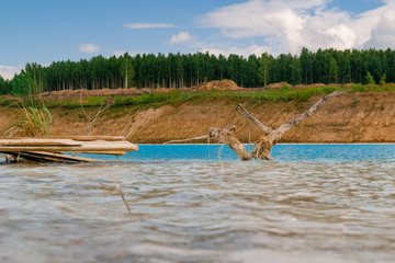 Beautiful turquoise lake in Novosibirsk. Dangerous lake with waste from  the Novosibirsk thermal power station
