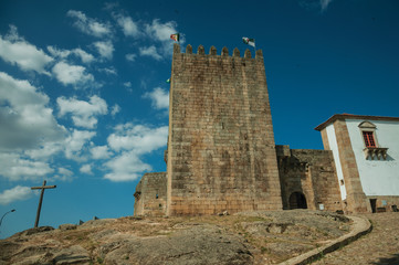 Fototapeta na wymiar Castle and square tower over rocky hill
