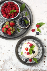 Mini Pavlova cakes with fresh berries