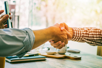 Shake hands lawyers in office. Counseling and Give an advice between private and government officials to find a fair settlement. instagram style filter