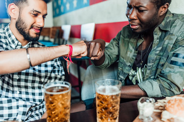 Brother  photo of two man give heands each other..