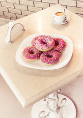 still-life with doughnuts in cafe