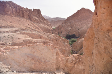 CHEBIKA, TN - JULY, 2019: Chebika Oasis lies at the foot of the mountains of the Djebel el Negueb and it is known as Qasr el-Shams (Castle of the Sun in Arabic).
