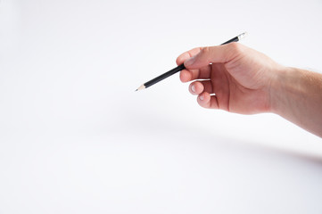 black pencil holds in his right hand. draws on a white background