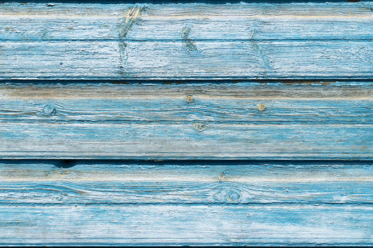 Texture old wooden blue background, several boards. Background of wood with cracked paint, old boards, free without objects. Billet wood horizontal boards wall.