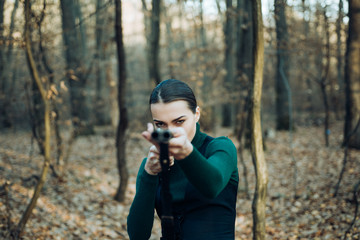 Hunting target. Target shot. female hunter in forest. woman with weapon. girl with rifle. chase...
