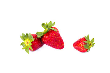 Strawberries on a white background. Group of red strawberries on a white background. Fresh and juicy strawberries on an isolated background.