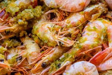 Background of the fresh boiled king shrimps with the oriental herbs