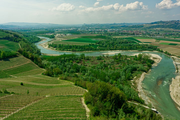 Fototapeta na wymiar Tanaro river and vineyards, Barbaresco area