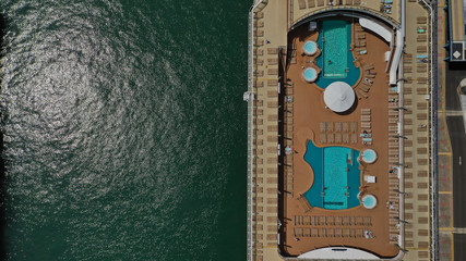 Aerial top view of cruise ship docked in Mediterranean destination